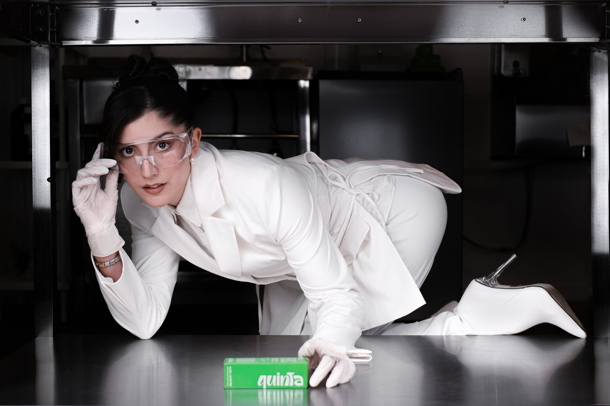 QUINTA's founder in the formulation lab — editorial campaign shot with a playful, high-fashion twist. Small-batch, petroleum-free natural skincare hand-formulated in Berlin.